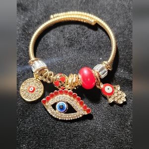 GOLD STAINLESS STEEL TWIST CHARM BRACELET